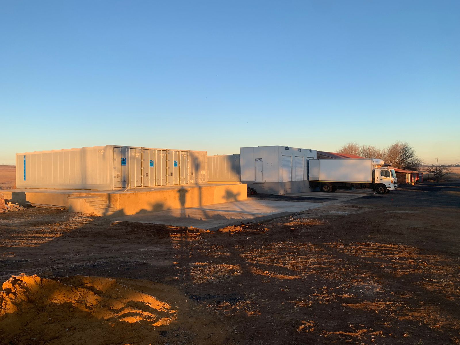 AquaCat fleet of refrigerated containers at Ballito depot at sunset, KwaZulu-Natal